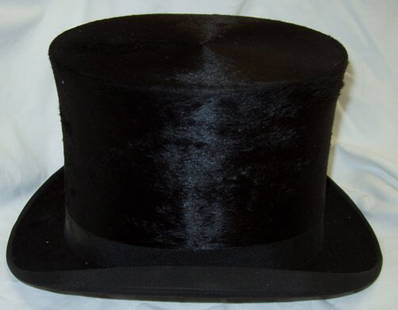 Beaver Top Hat by Ernst Ottilige Verden A.D. Aller: P. & C. Habig Wien Berlin K.K. Dester Hokhut Fabrikanter. Hat Size: I believe its 56 1/2. The tag is hard to read. It could be 50 1/2. The inside circumfrence is 6 1/4" x 7 3/4". Hat box is