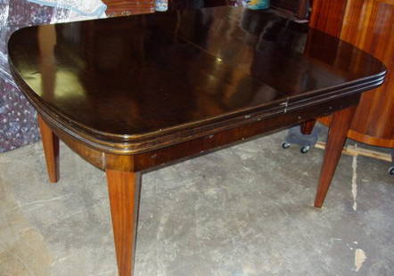 Art Deco European Rosewood Dining Room Table: The 2 tops pull out for extension on table. Rosewood legs. Table: 59"w x 43 1/2"d x 31 1/4"h. First extension: 105" length. Last extension: 151" length. Unbelievable triple