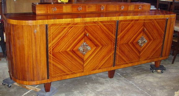 Art Deco European Rosewood Buffet, Sideboard: 111 1/2"w x 29"d x 42"h. Some veneer chips with some age separation cracks. One round drawer pull is partialy missing. One piece and 2 bottom inserts for fitted drawers is missing. I have