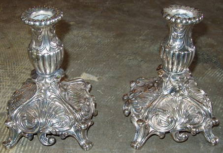 Silver Candle Sticks in Pot Metal: No signatures. One small hair line crack in middle of the cast. Some of the silver is worn. 5"w x 5"d x 6 1/2"h.