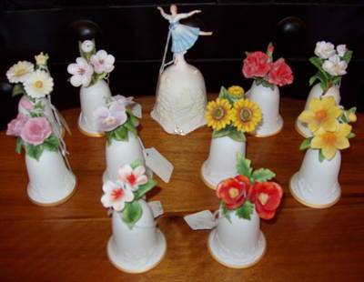 Danbury Mint Bisque Bell Collection: 11 pieces, 1 ballerina & 10 flowers. Over all good condition. The ballerina is signed "Giselle". The flowers are The 25 American Flower Bells.