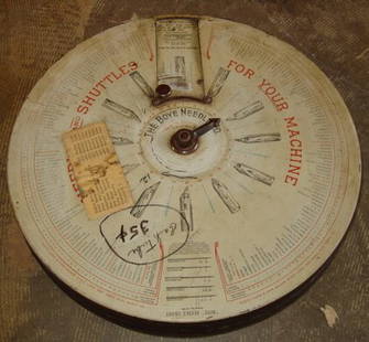 Antique Needle Container with Needles: Needles and Shuttles for Your Machine. The Boyle Needle Co. Reg. U.S. Pat. Jan. 26, 1909. Some wear, good condition for its age. 16"dia x 3 1/4"h.