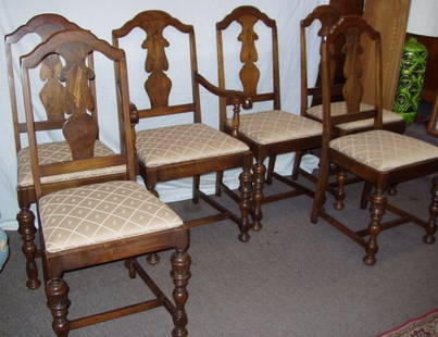 Antique Walnut Dining Room Chairs: 6, 1930's Dining Room Chairs in Walnut. 5 Side chairs: 18"w x 18"d x 40"h. 1 Arm Chair: 23 1/2"w x 20"d x 40"h. These Chairs has matching Table, China Cabinet, Buffet & Server. Please see our