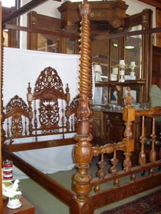 19th Century India Carved Canopy English Style: 19th Century English Heavily Carved Rosewood & Teakwood Canopy Bed with the Coats of Arms. This bed was made in India with English Influence. The Englishman worked in India and had this bed made for