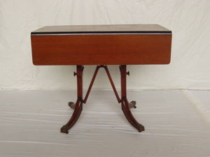 Mahogany Drop Leaf Dining Room Table/Coffee Table: Duncan Phyfe Style Mahogany Drop Leaf Table. It could be used as a dining room table or coffee table. When the drop sides are open it measures 36"w. When its adjusted to be used as a coffee table, it