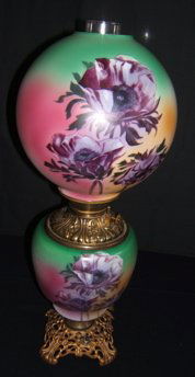 Gone With The Wind Hurricane Lamp: In good condition. There is a hair line crack on the shade, it is almost unnoticeable. It could be a scratch before they painted the shade. 9"dia. x 24"h.