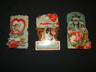 3 German Antique Folding and Opening Valentine Car: Very rare. The dog card opens from the top. Approx. size 4 1/2"w x 7 1/4"h 1890's Germany. Valentine greeting heart opens and stands. Is made in Germany with birds. Approx. size 3 1/2"w x 7"h. Angel a