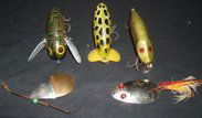 5 Fishing Lures: Fishing Lures by Heddon - Fried Arbbrgast, Jitter Bug - Crazy Crawler. 3 lures, 1 spinner, 1 pop gear. Heddon body only: 1" x 2 1/4". Jitterbug body only: 1 1/2" x 2 3/4". Lite Green body only: 3/4" x