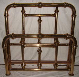 Antique Victorian Style Brass Bed: Massive proportions very large bed. 3/4" size with rails. Two of the center posts should be tightened up. There are a couple of tears in the brass, as pictured. One small dent on back of the foot boar