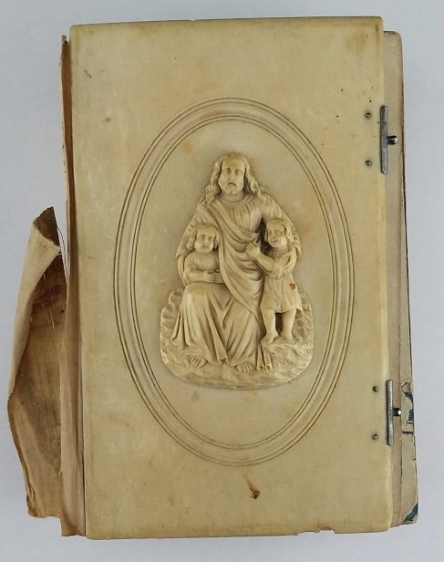 Antique European Ivory Cover Prayer Book: Spanish, made in France, 5" x 3.5" Book is in poor condition but front and back cover have beautiful hand carved religious ivory pieces.