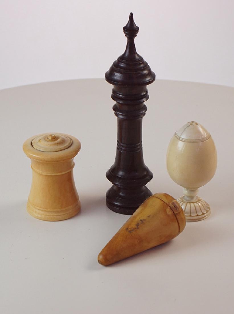 Treen needle case: Treen fruit wood needle caseIn the shape of a large tower along with bone ponce pot footed Cotton holder lacking base and one other vegetable ivory cone shaped piece Country: UKDimensions: 4.5"ht Poun