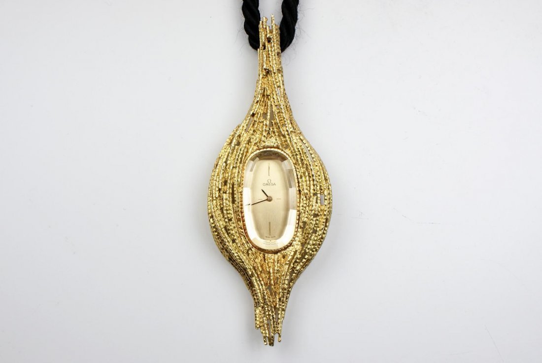 Andrew Grima for OMEGA 'Harvest' pendant watch: 18ct yellow gold Andrew Grima for OMEGA 'Harvest' pendant watch within a wheatsheaf inspired case with a brushed gold dial, quarter baton hour indices, baton hour hands, on a silk woven cord necklace.