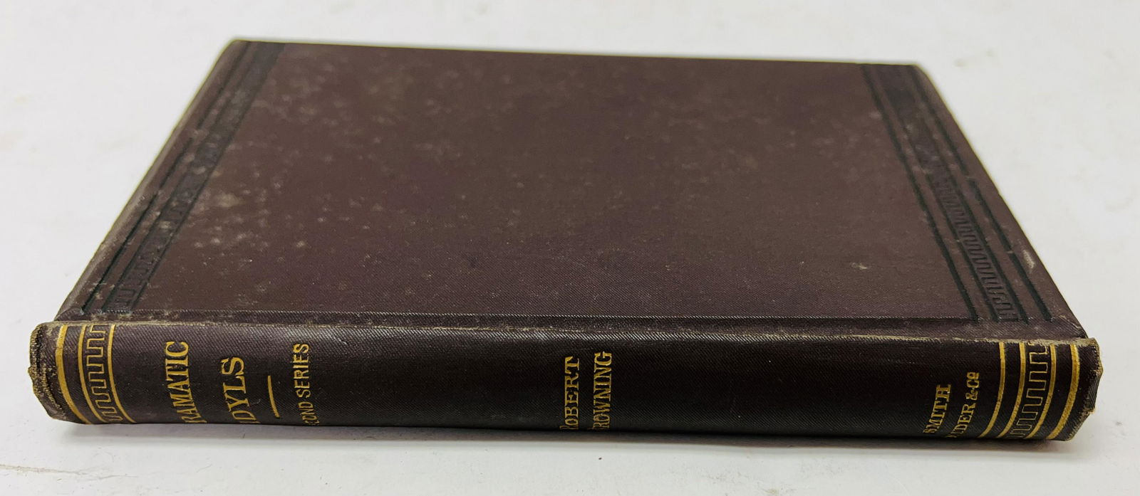 A copy of Dramatic Idyls, Second series by Robert Browning, published by Smith, Elder & Co. 1880,: A copy of Dramatic Idyls, Second series by Robert Browning, published by Smith, Elder & Co. 1880, brown canvas with black and gold detailing, inscription to the inside reads Lady Lindsey with RBs best