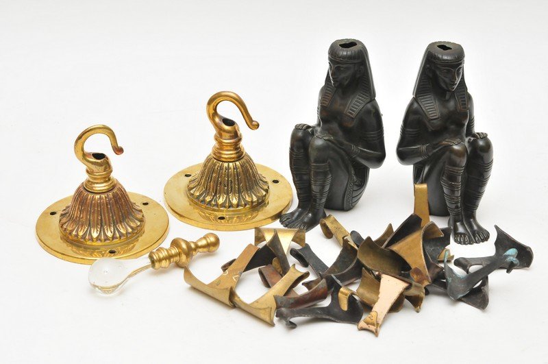 A pair of small bronze seated Sphinx garnitures with a: A pair of small bronze seated Sphinx garnitures with a collection of Edwardian hooks and a toilet pull