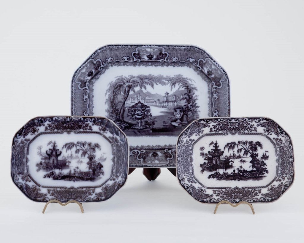 Seven pc Grouping of Staffordshire Transferware: Black and white, consisting, Platter (16" x 12"), 2 small rice plates (11" x 8.5") 2 plates (10.5") Plate (8.25") Small plate (6.5") Good to excellent condition.