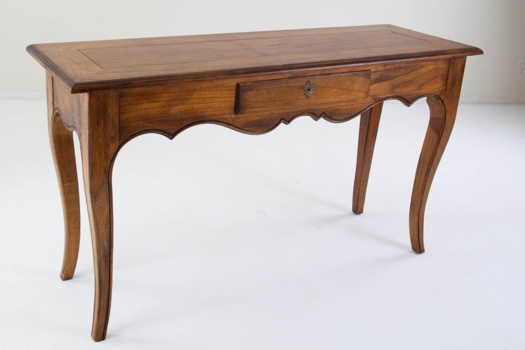 Carved Walnut Sofa Table: early 20th century Rectangular top with single drawer, carved scroll frieze and cabriole legs. Made by Herman in Grand Rapids, Michigan. Very good condition. height 30in; width 53in; depth 18in