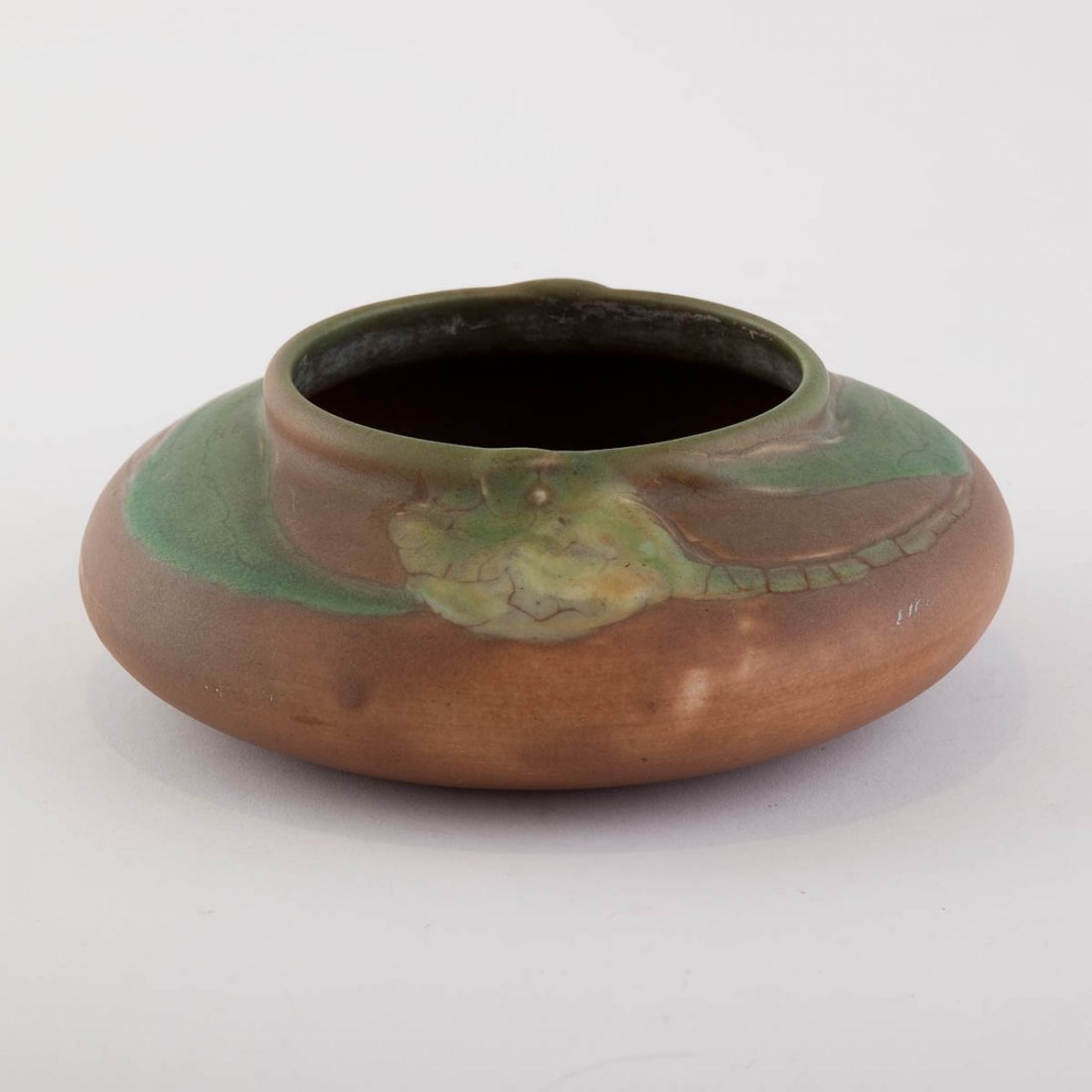 1905 Rookwood Pottery Bowl by Sally E. Coyne: Embossed mark, V, 923 With brown and green swirls. height 2.5in; width 6.5in