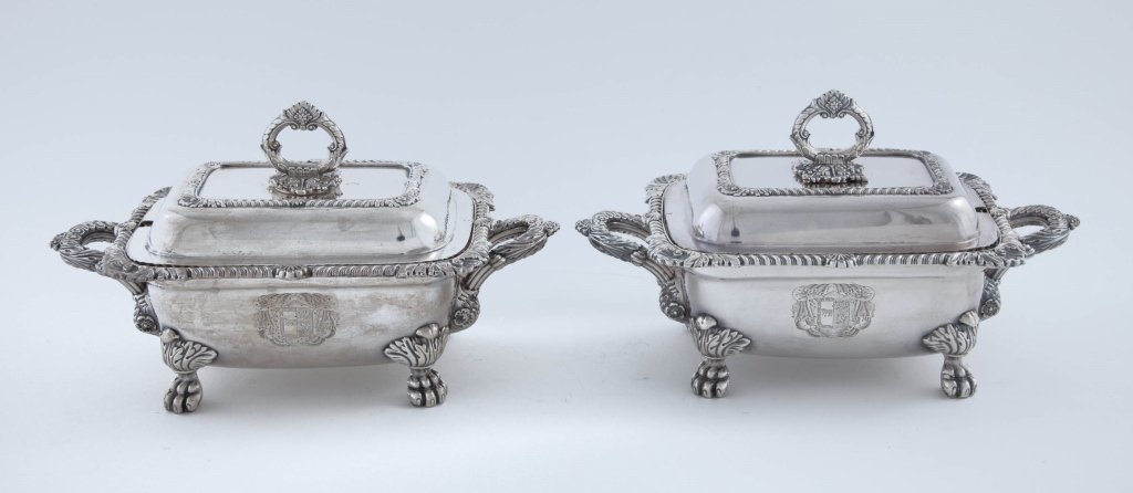 Pair of Old Sheffield Plate Gravy Tureens: circa 1820 Oblong sauce tureens and covers with shell and gadroon mounts, on four paw feet. Engraved with Coat of Arms. height 5.5in; width 9.5in; depth 5.25in