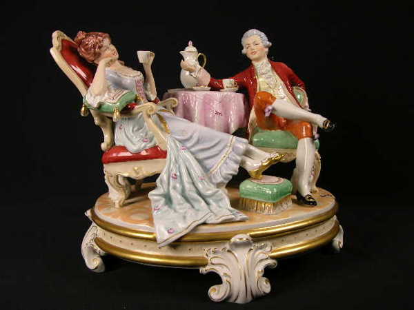 ROYAL DUX GROUPING OF A MAN AND WOMAN SIPPING TEA
