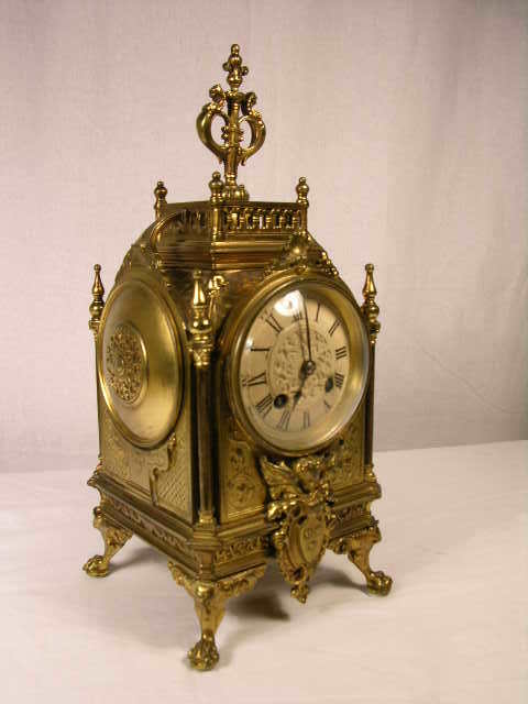 GILT BRONZE MANTLE CLOCK (FRENCH) WITH CHRUB ONAM