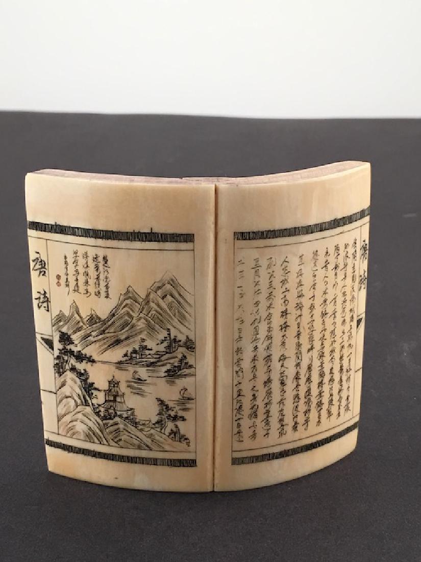 A carved book opened to two written pages (1 of 6)