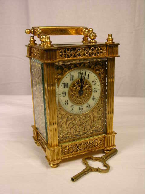 "ANTIQUE BRASS FILIGREE CARRIAGE CLOCK WITH RECT