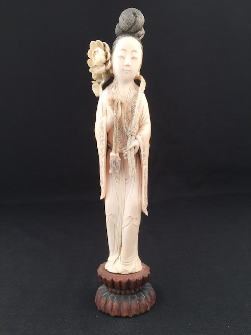 A fine carving of a beauty on a wood base. (1 of 9)