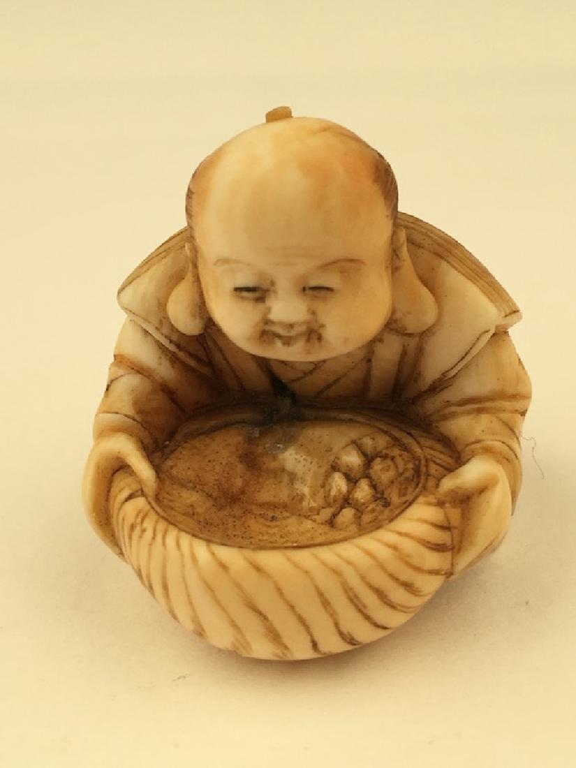 Antique carved Netsuke figure of a woman preparing food (1 of 6)
