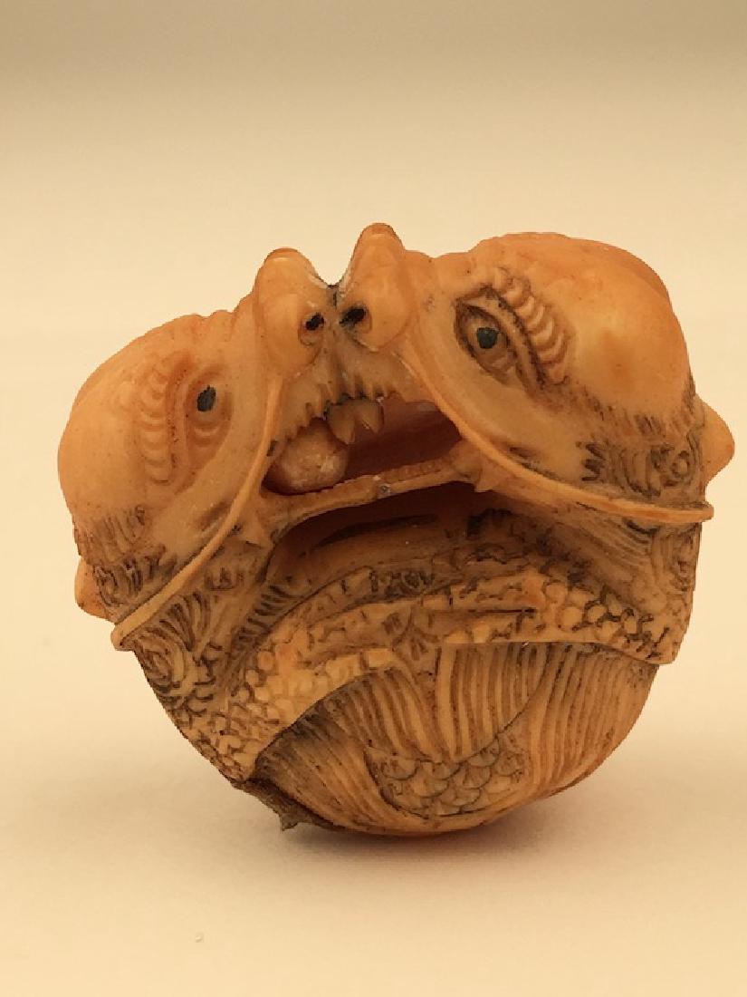 Antique carved Netsuke figure of two animals biting at (1 of 6)