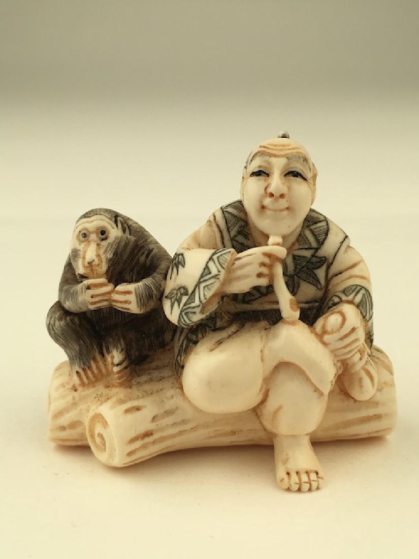 Antique carved Netsuke figure of a man and monkey (1 of 5)