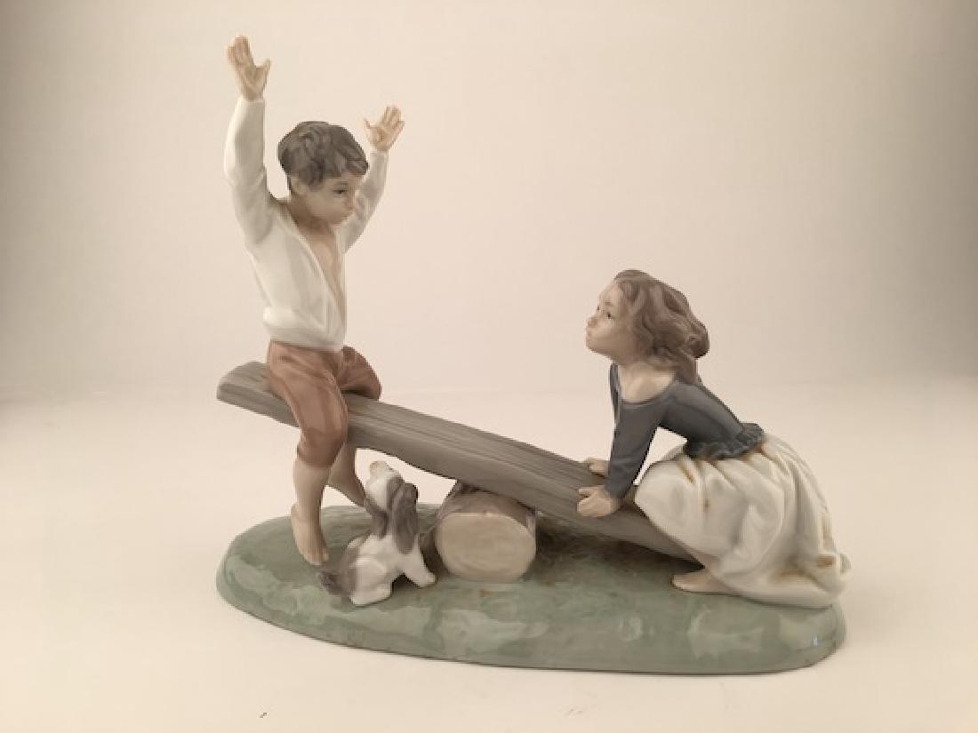 Retired Lladro figure "See-Saw". Stamped with the (1 of 9)
