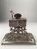 A sterling silver mechanical singing bird box with a