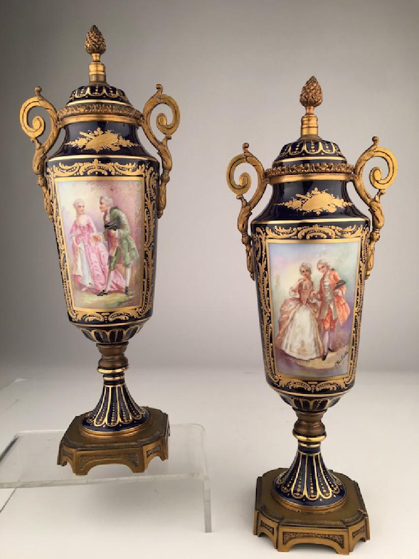 Pair of Sevres urns with gold dore bronze handles and (1 of 8)