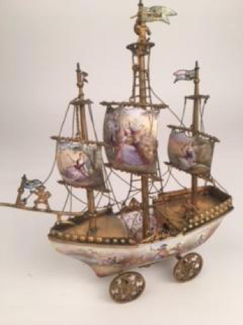 19 th Century Viennese painted enamel three masted: 19 th Century Viennese painted enamel three masted sailing vessel mounted on four moving wheels.height 7 1/2 inches.