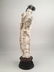 Large carved beauty holding a Lotus flowers. Mounted on