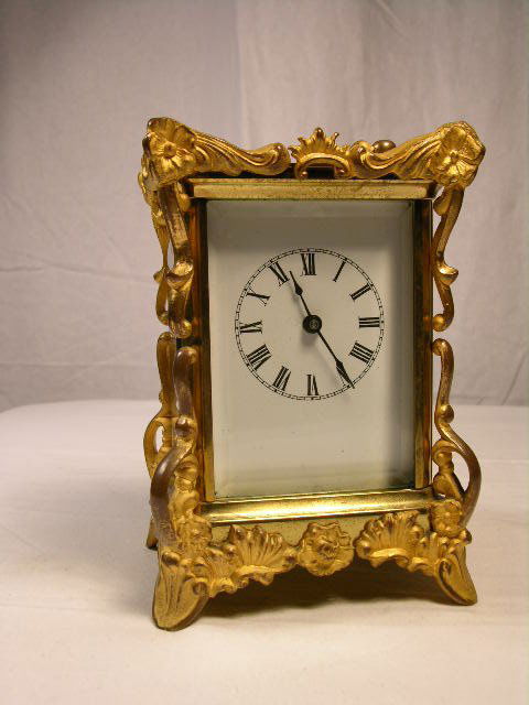 "WATERBURY CLOCK CO" 8 DAY ORNATE CARRIAGE CLOCK.: "WATERBURY CLOCK CO" 8 DAY ORNATE CARRIAGE CLOCK. PATENTS 1891 AND 1890.OVERALL HEIGHT 6 1/2"