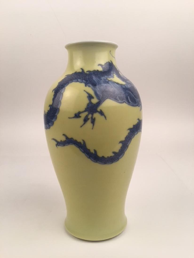 Makazu Kozan Japanese porcelain vase: Circa 1900 Makazu Kozan Japanese porcelain vase with a large Dragon around the vase o a deep yellow ground.SIgned on the bottom.Height 9 inches. Rim opening 2 3/8 inches.(Restored).