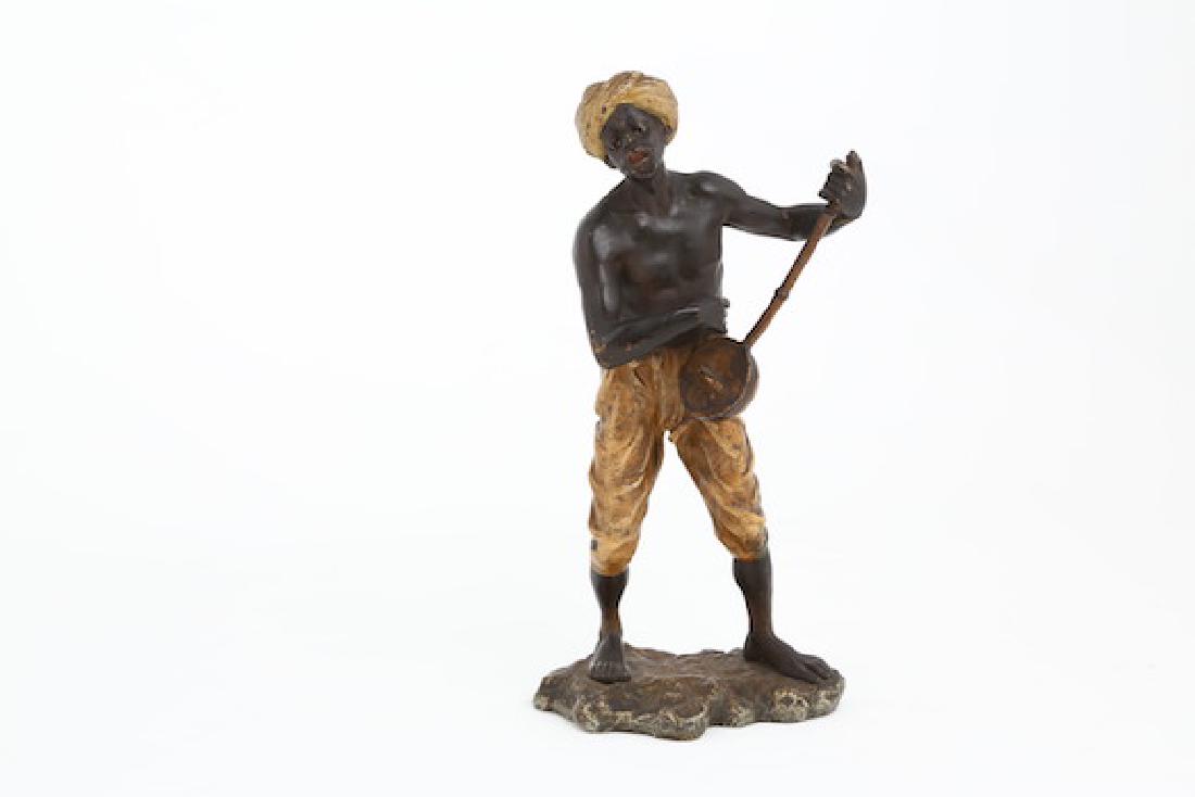 Bergman Vienna bronze figure of a man with mandolin.: Bergman Vienna bronze figure of a man with mandolin. Marked with monogram. Height 7 1/2 inches.