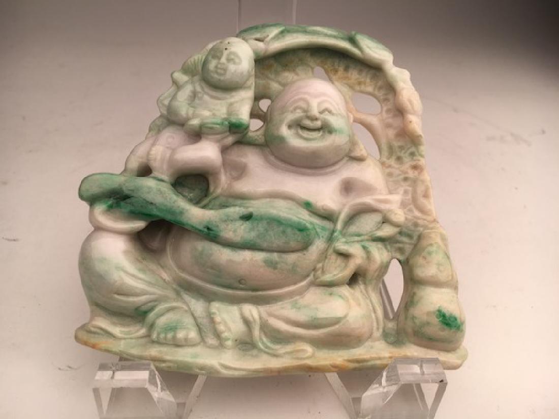 Carved Chinese jade figure of a smiling Buddha. (1 of 4)