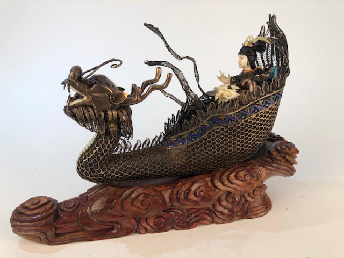 Chinese figure of a woman in a silver boat. (1 of 10)