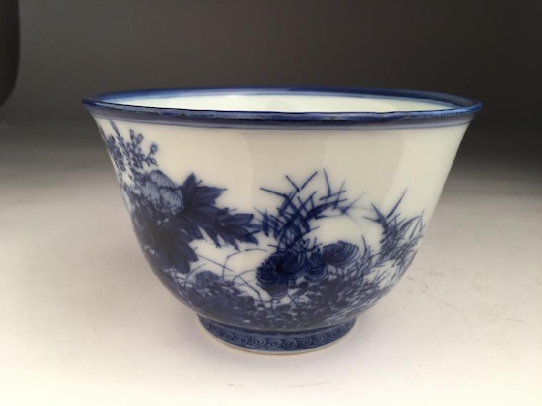 19 th century Japanese blue and white bowl.: 19 th century Japanese blue and white bowl. Signed on the bottom. Height 3 1/2 inches. Diameter 5 1/4 inches. (Minor age crack to bottom).