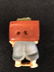 Carved Netsuke figure of a man with a staff and wearing - 2