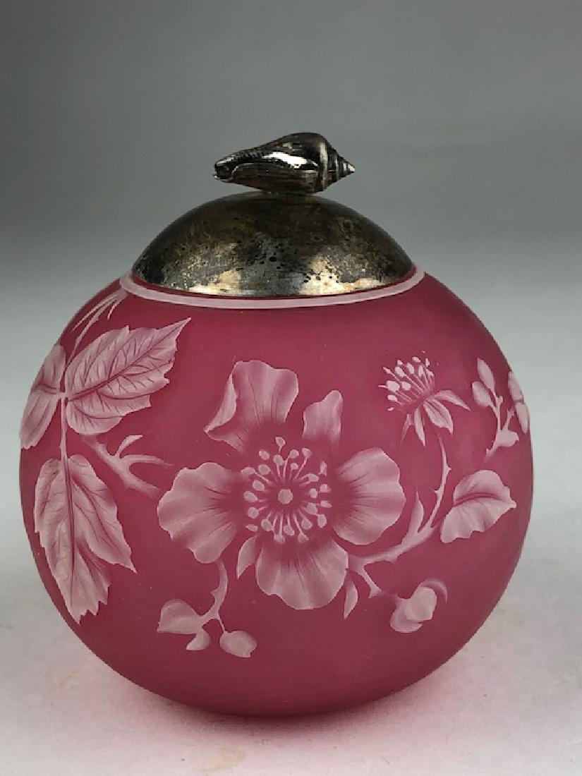 Circa 1920 cameo round glass jar with a silver cap with: Circa 1920 cameo round glass jar with a silver cap with a conch shell on the top.Height 3 inches.