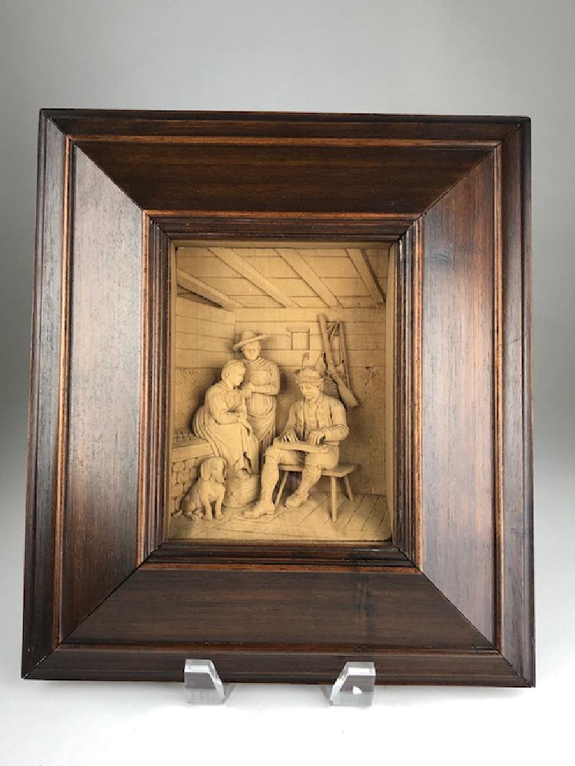 Antique German black forest carving: Antique German black forest carving of a hunt scene framed in a display case. Wood carving 5 inches x 6 1/2 inches. Overall with frame 10 inches x 11 inches.