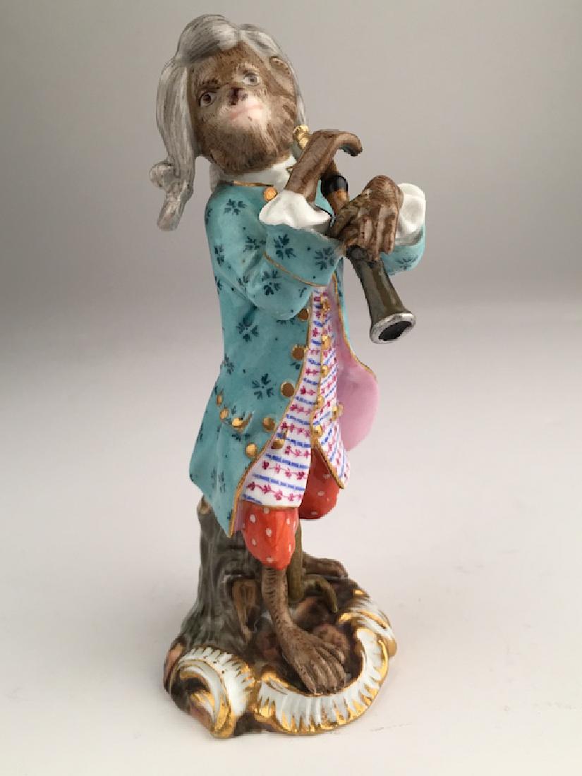 Meissen monkey band member playing a piccolo.: Meissen monkey band member playing a piccolo Properly marked with Meissen crossed swords. Height 5 inches. (The end of the piccolo was glued).