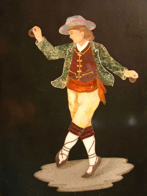 PIETRA DURA PLAQUE OF A MAN DANCING WITH A RING IN: PIETRA DURA PLAQUE OF A MAN DANCING WITH A RING IN HIS RIGHT HAND. PLAQUE MEASURES 6" WIDE X 9" HIGH. OVERALL WITH FRAME 8 1/4" X 11 1/2".