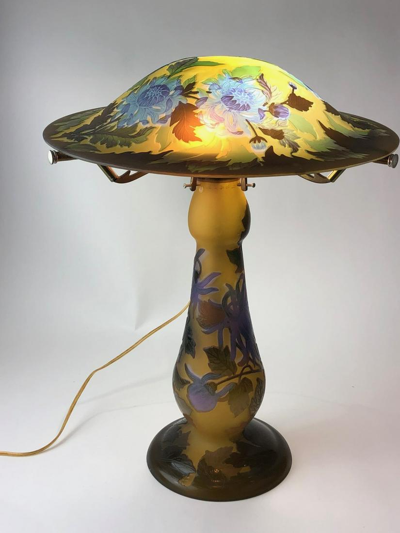 Circa 1980 cameo glass two light lamp base and shade.: Circa 1980 cameo glass two light lamp base and shade in the style of Galle with a mushroom top shape shade. Overall height 20 inches .
