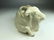 A wonderful porcelain model of a reclining goat in a hi - 7