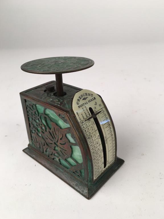 Tifffany Studios "Grapevine" postal scale.: Tiffany Studios "Grapevine" postal scale with green glass. Stamped "Tiffany Studios New York". Height 3 1/4 inches.