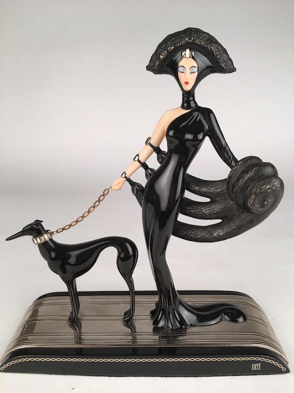 A limited edition hand painted fine porcelain figurine: A limited edition hand painted fine porcelain figurine from the Franklin Mint.House of Erte series featuring an Art Deco women in high fashion with her her elegant black greyhound with faux diamond co